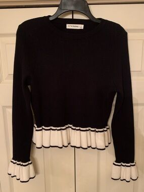 In The Beginning Black Ruffle Hem & Cuff Sweater with White Trim